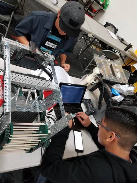 1879J making some last minute updates to their robots program.