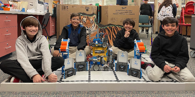 Vex students with their robot