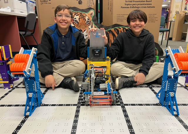 Vex students with their robot